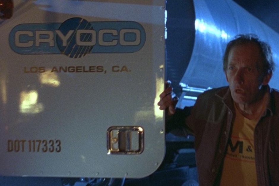 <p><strong>Figure 2.1</strong> When the Cryoco truck driver exits the vehicle to view the helicopter wreck, we see the company logo and location on the door.</p>