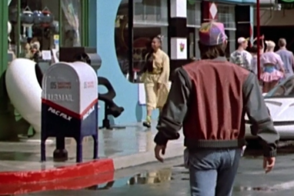 <p><strong>Figure 2.2</strong> As Marty approaches Cafe 80s, wee see another from the back.</p>