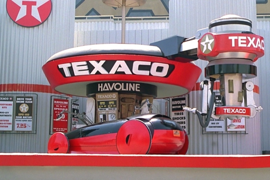 <p><strong>Figure 1.2</strong> As robotic arms go to work servicing the car, a machine voiced slogan states “You can trust your car to the system with the star.”</p>